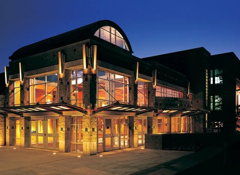 Photo of the outside of the Missoula Children's Theater at night.