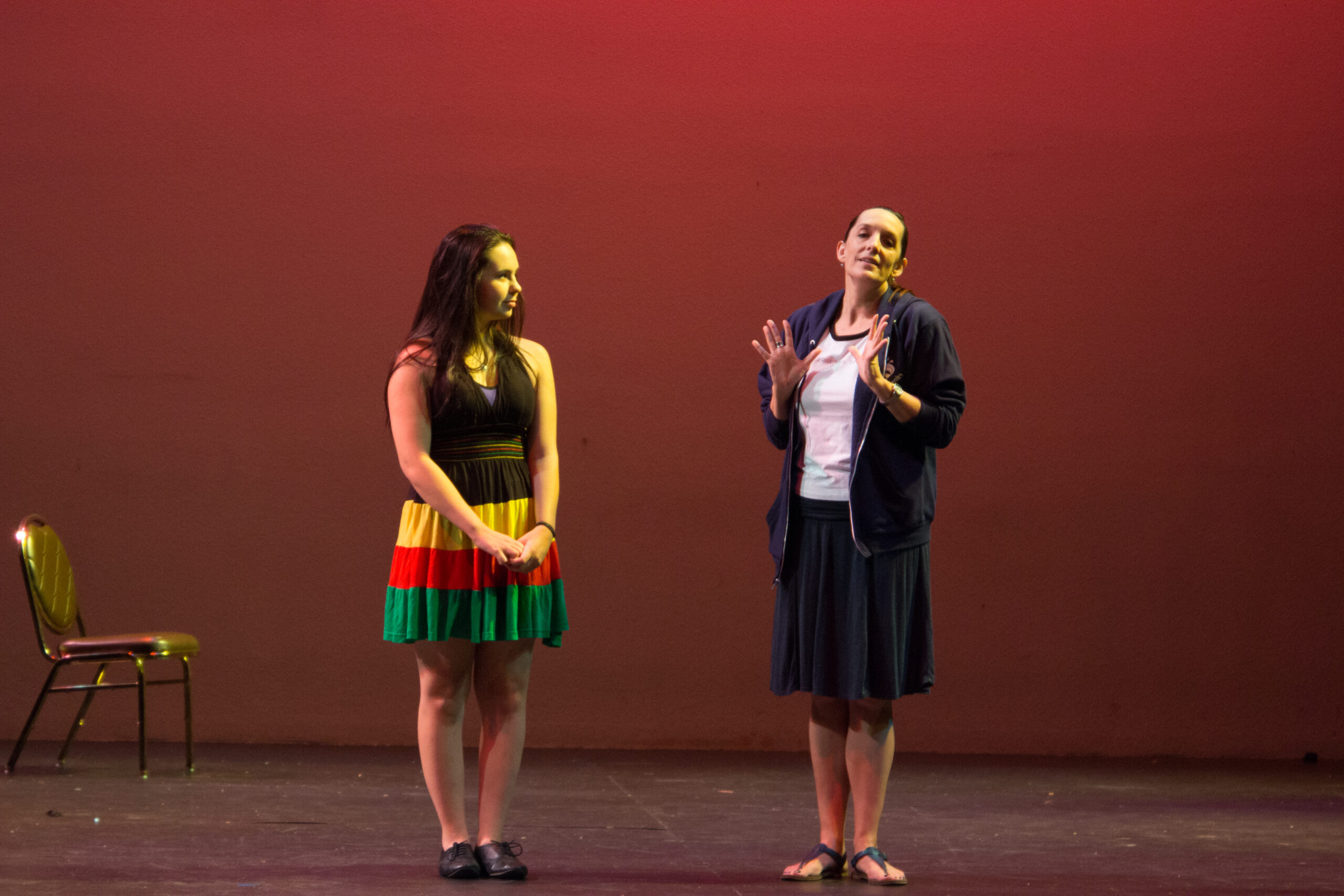 Photo of two performers on stage